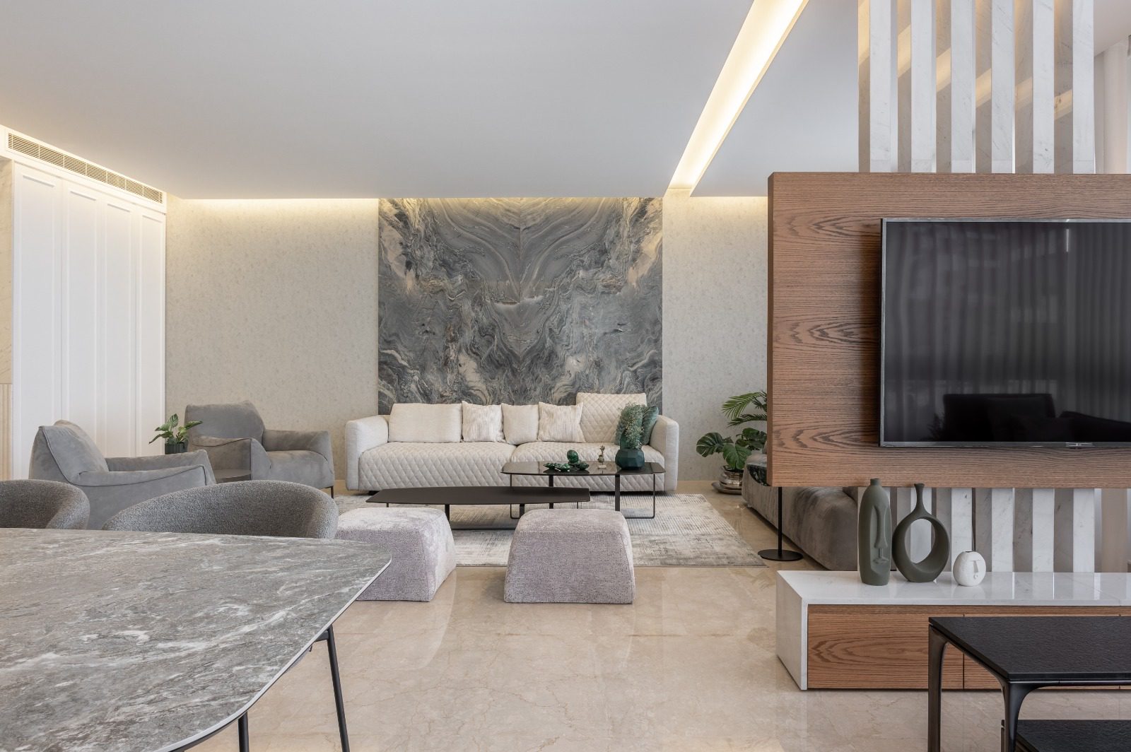 Book-matched marble feature wall in a contemporary living interior