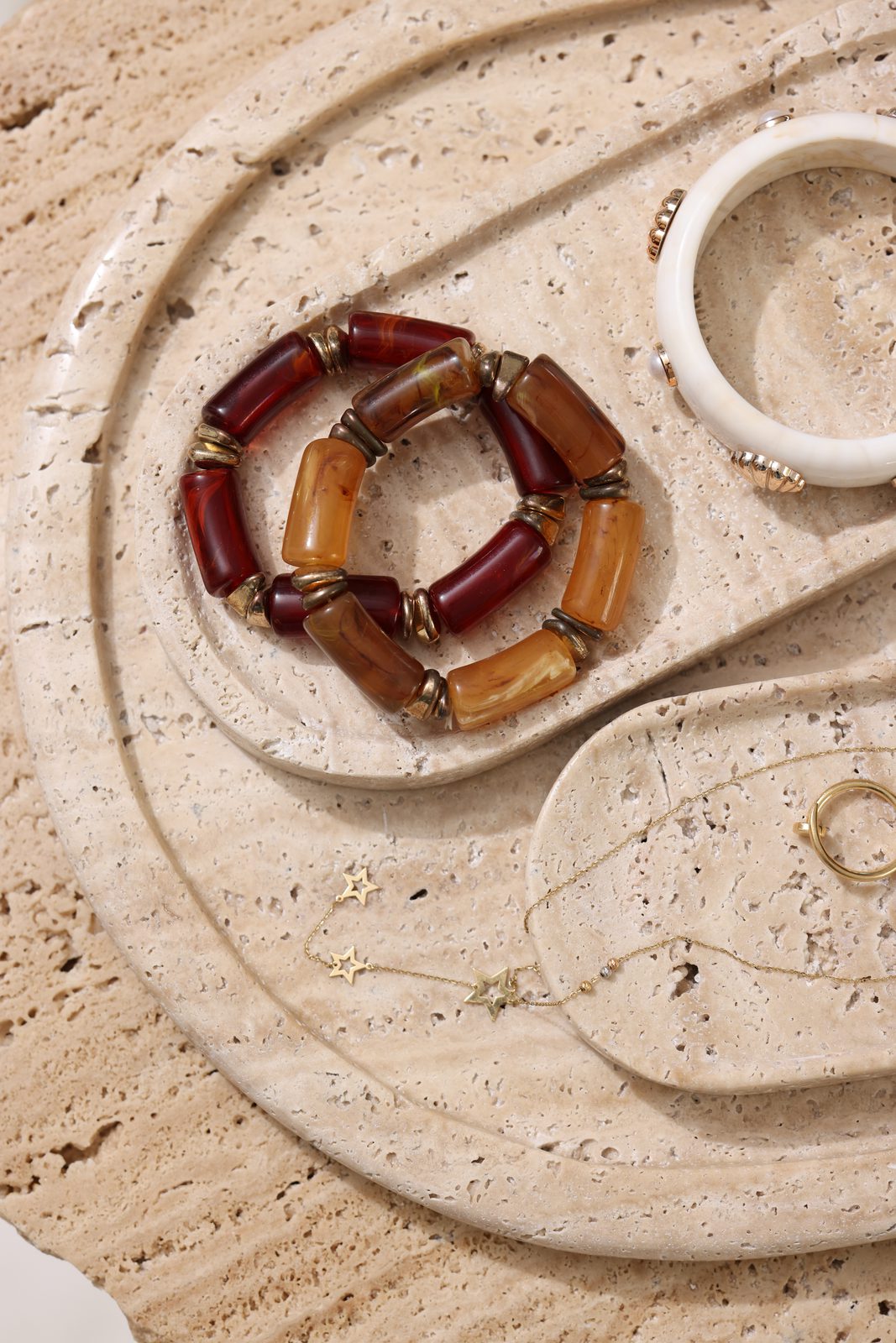 Travertine trays styled with jewellery